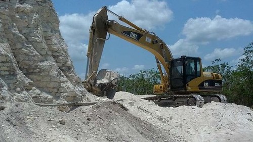 A construction company has essentially destroyed one of Belize's largest Mayan pyramids with backhoes and bulldozers to extract crushed rock for a road-building project.